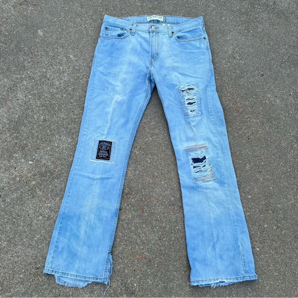 Levi’s 527 Low Boot Cut Jeans upcycled distress patched art to wear Jack Daniels